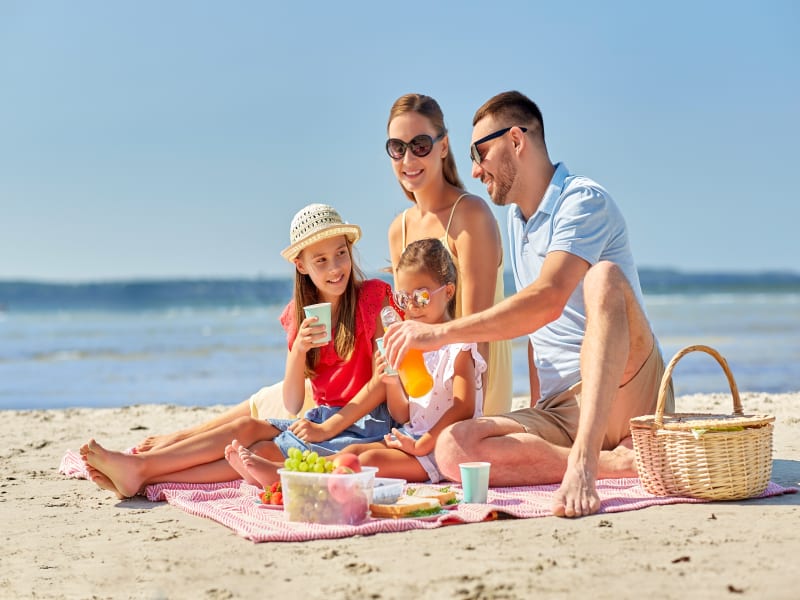 A family picnic on a sandbank in Maldives